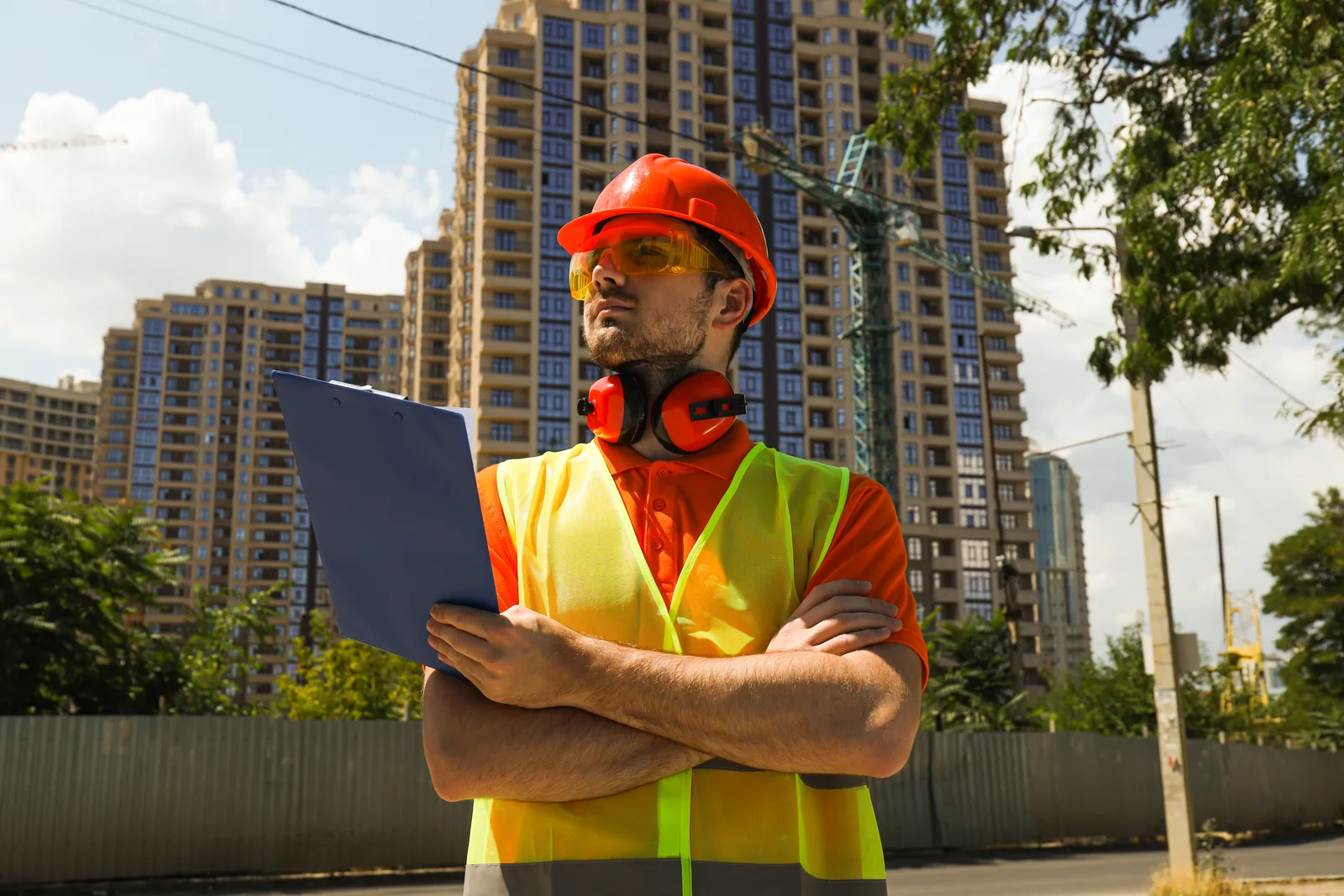 Young civil engineer in a safety hat on a Melbourne construction site — why builders need a specialist marketing agency